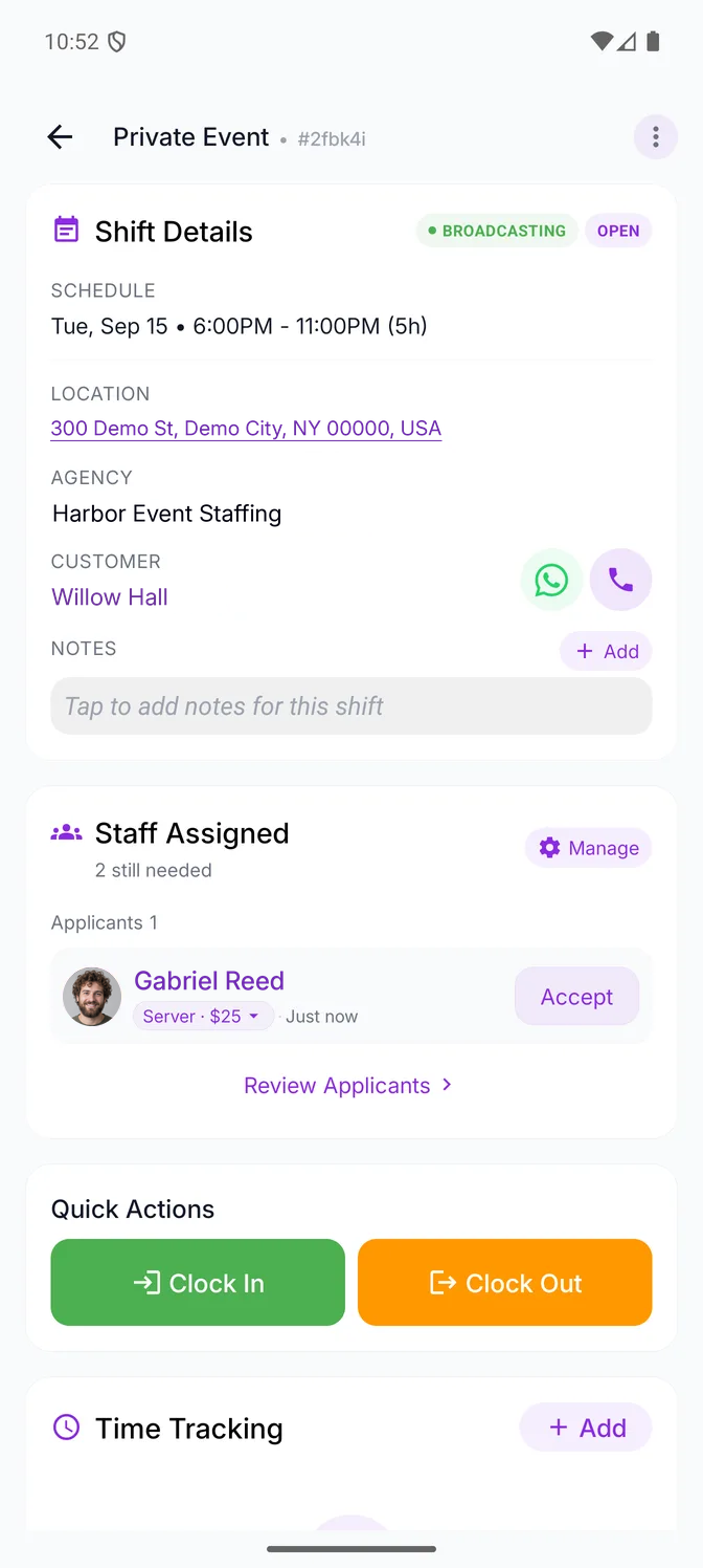 An open shift in the Eventmatch mobile app, seen by the business: Broadcasting and Open badges beside the shift details — the schedule, the address, the agency, the customer with buttons to message or call them, and notes — then the assigned-staff card saying two people are still needed, one applicant waiting with the position and rate they applied at and an Accept button beside them, a link to review all applicants, and the clock-in and clock-out actions.